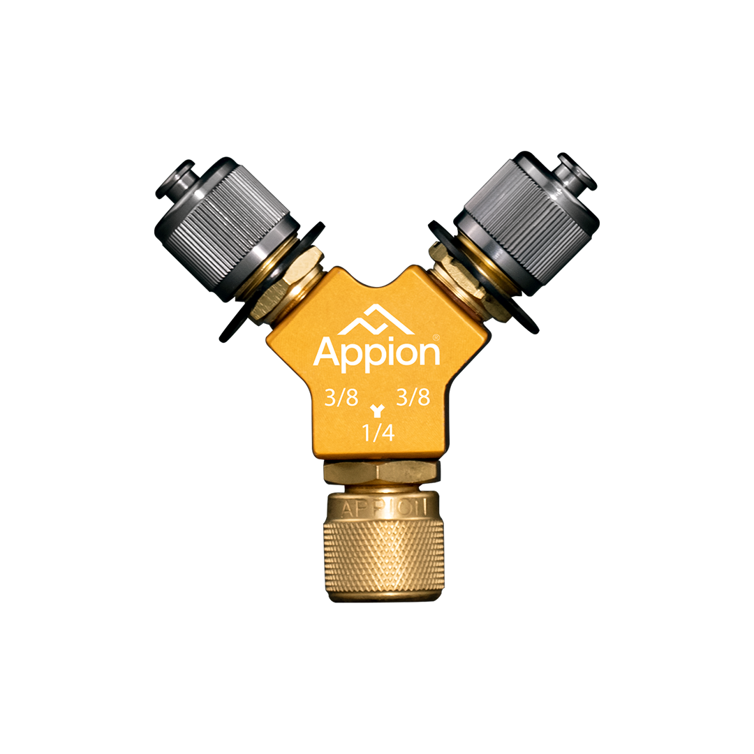 A yellow brass garden hose splitter with two gray shutoff valves, labeled 'Appion', with sizes 3/8 and 1/4 inches indicated, against a black background.