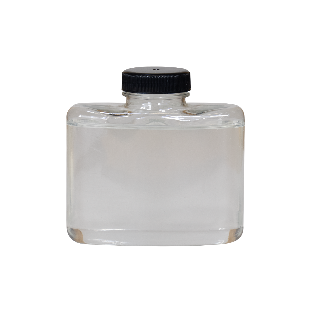A clear glass bottle with a black screw cap, filled with a transparent liquid, isolated on a plain background.