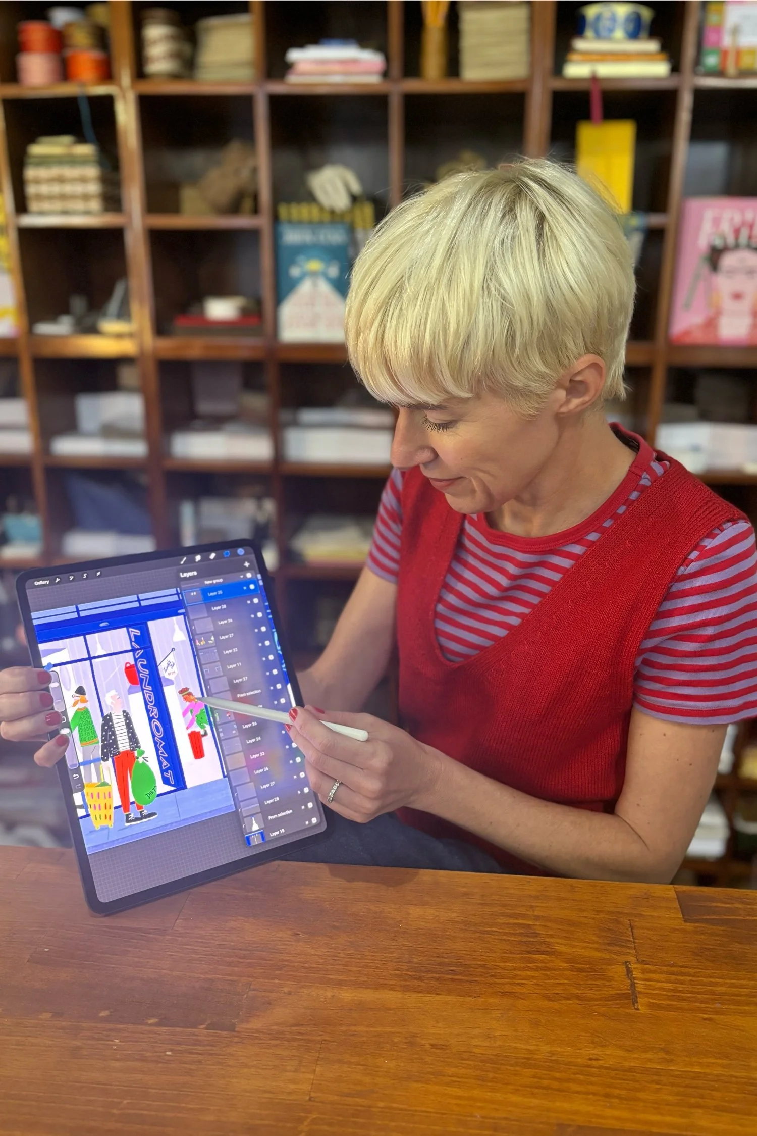 Professional illustrator Susanna Harrison demonstrating her digital drawing techniques on an iPad during a Procreate workshop at Paper Caravan