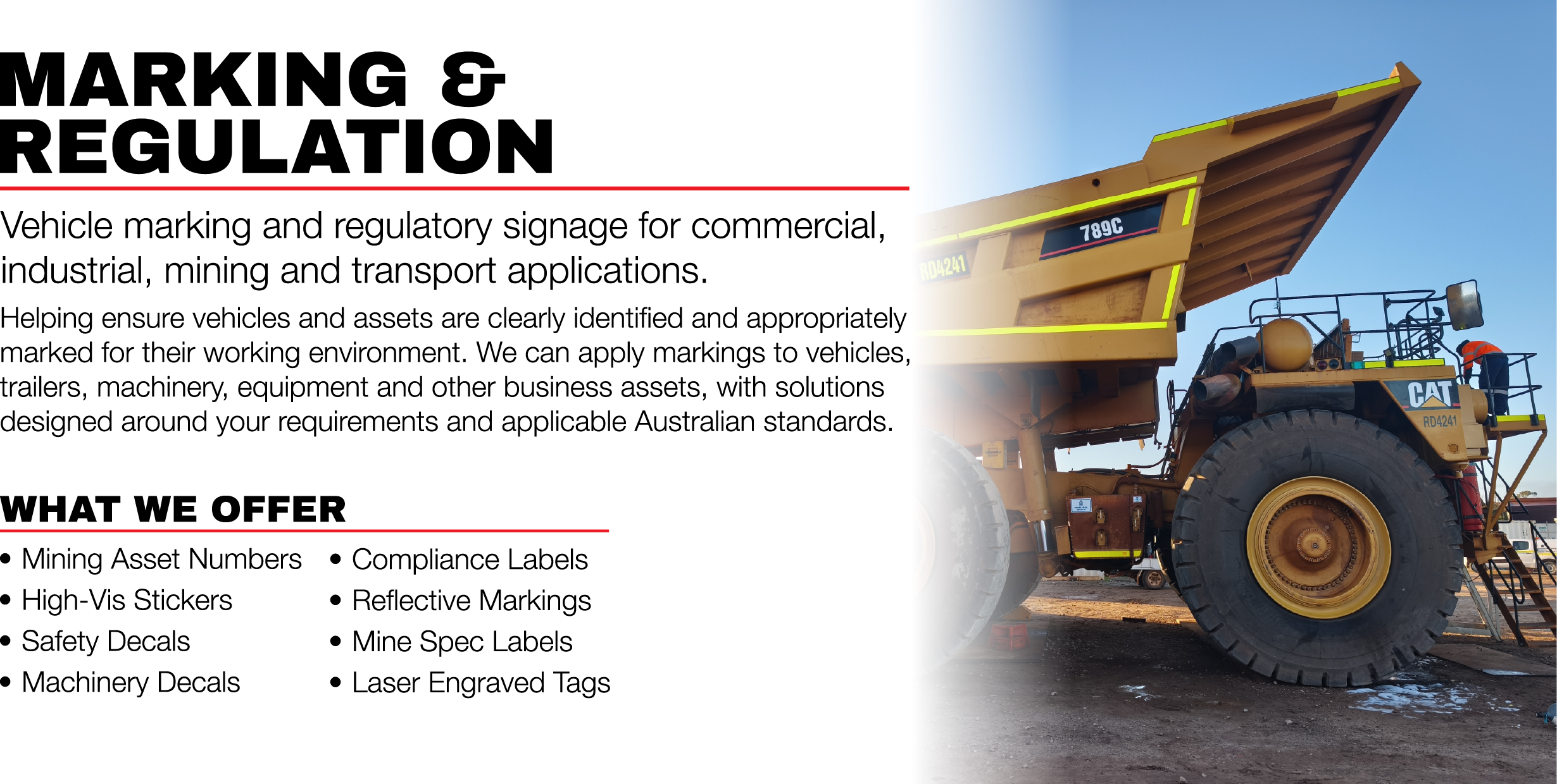 Signage about vehicle marking and regulation for industrial and transport applications, with a large mining dump truck in the background with decals and high visibility striping
