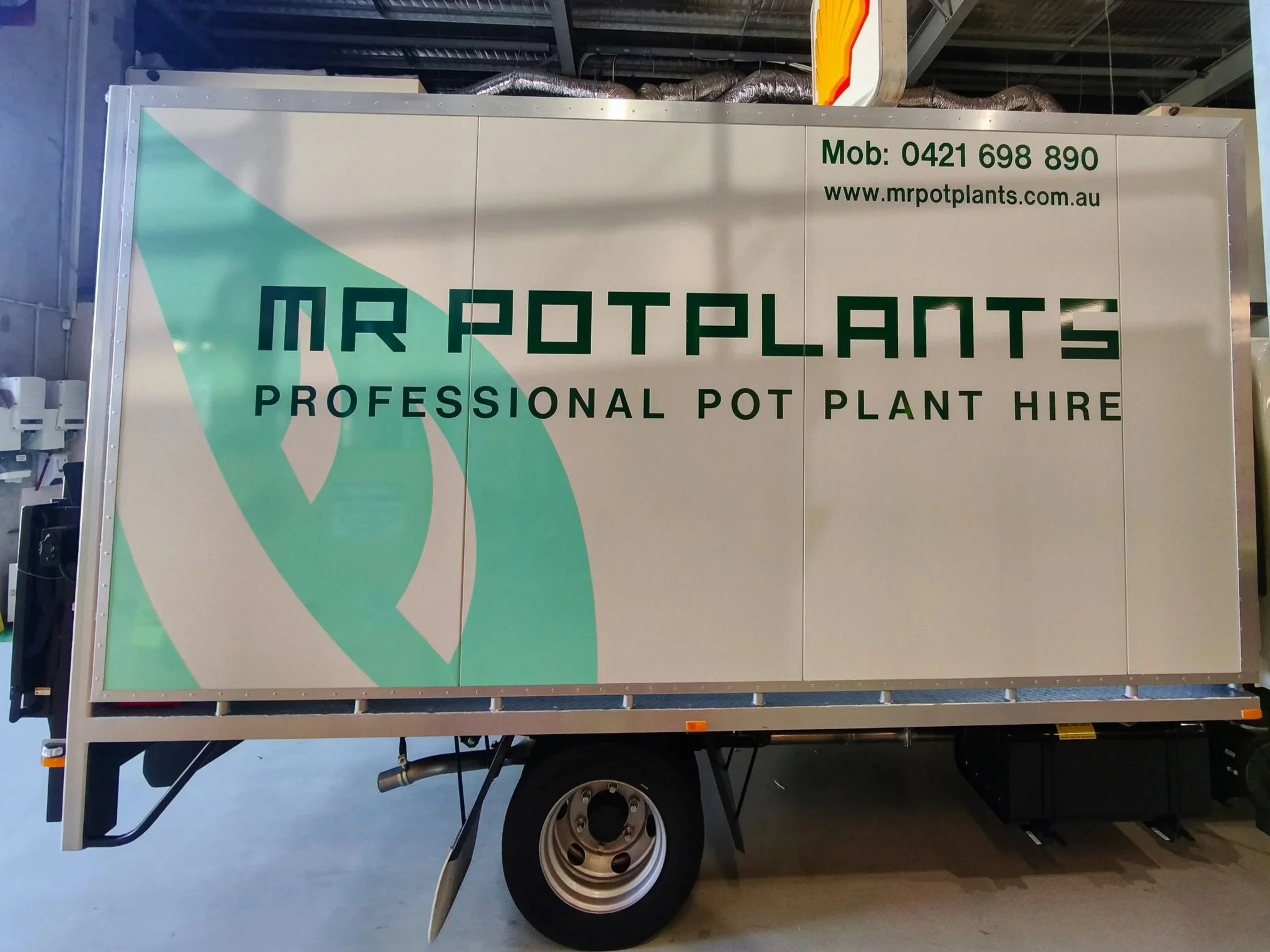 Delivery van signage for MR Potplants with large decals giving high brand visibility and exposure. Vehicle branding