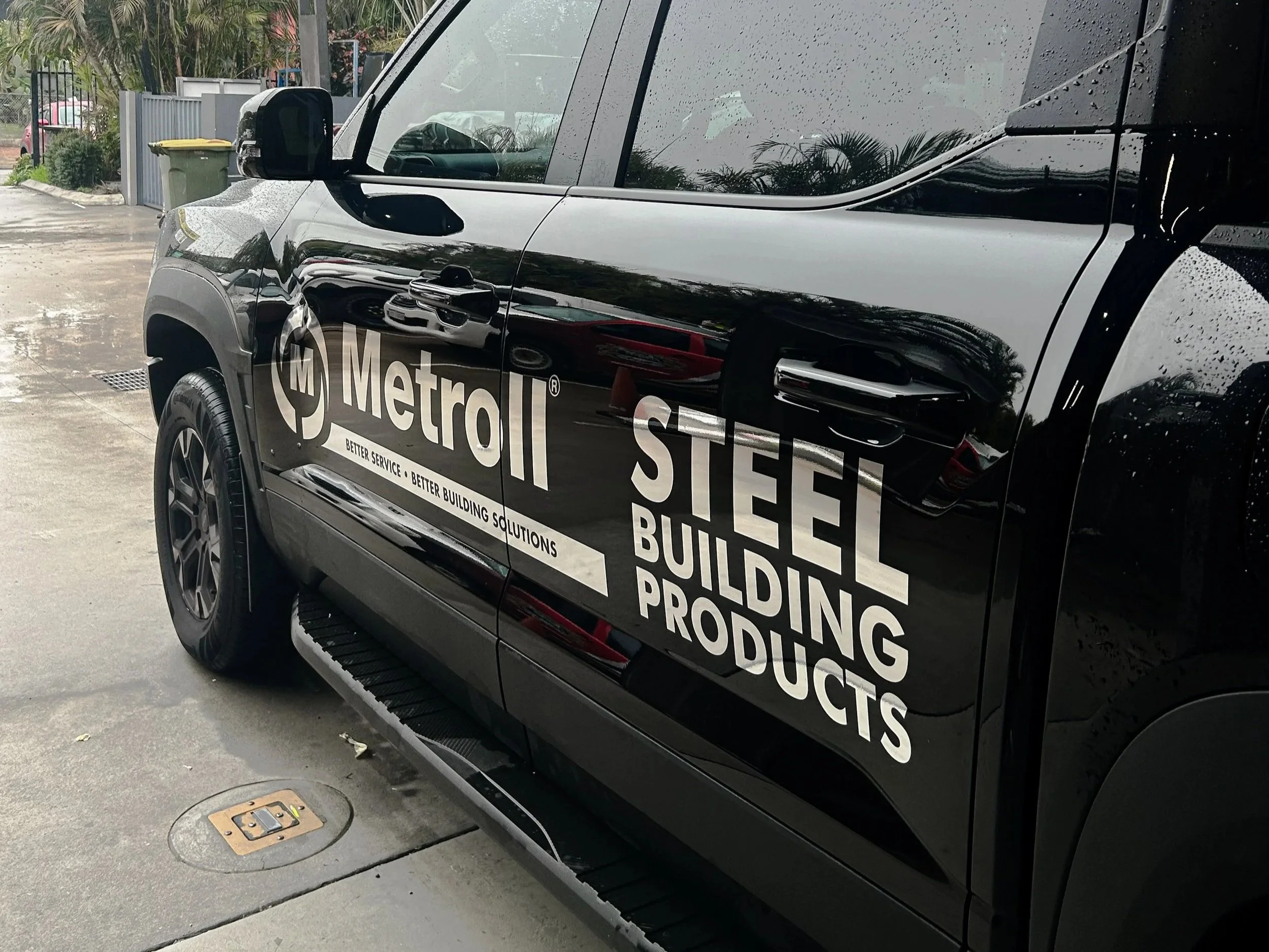 A ute with chrome decal branding for Metroll. Vehicle branding