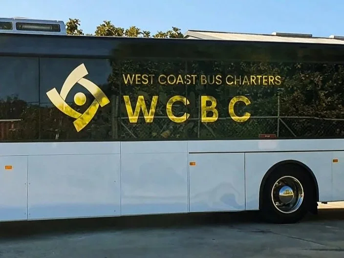 A Charter Bus with shiny gold decals for WCBC West Coast Bus Charters. Commercial Vehicle Signage Perth. Perth Bus Signage. Malaga Bus Decals. Malaga Vehicle Signage. Malaga Commercial Signage. Malaga Vehicle Branding.