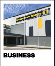 Exterior of Expressway Spares commercial warehouse with large yellow and black signage. Industrial Signage. Commercial Signage. Retail Signage. Business Signage