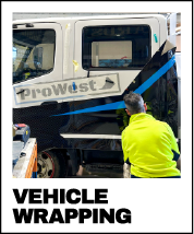 a person installing a vehicle vinyl wrap to a truck to add branding - vinyl wrapping