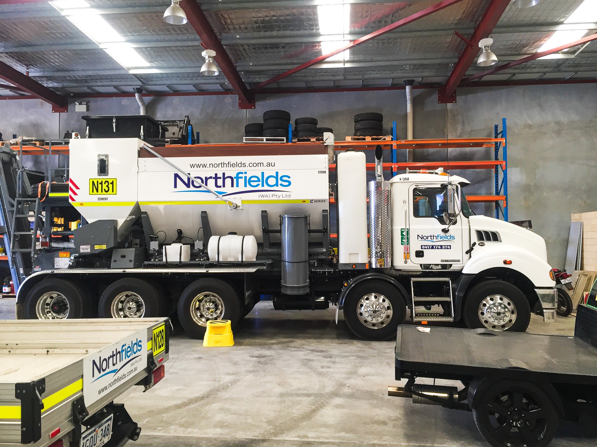 A large water truck with Northfields Contracting decals in Perth, WA. Truck branding Perth, WA. Heavy Vehicle Branding Perth. Truck Signage Perth. Truck Decals Perth. Machine Signage Perth. Bassendean Truck Branding. Bassendean Vehicle Signage
