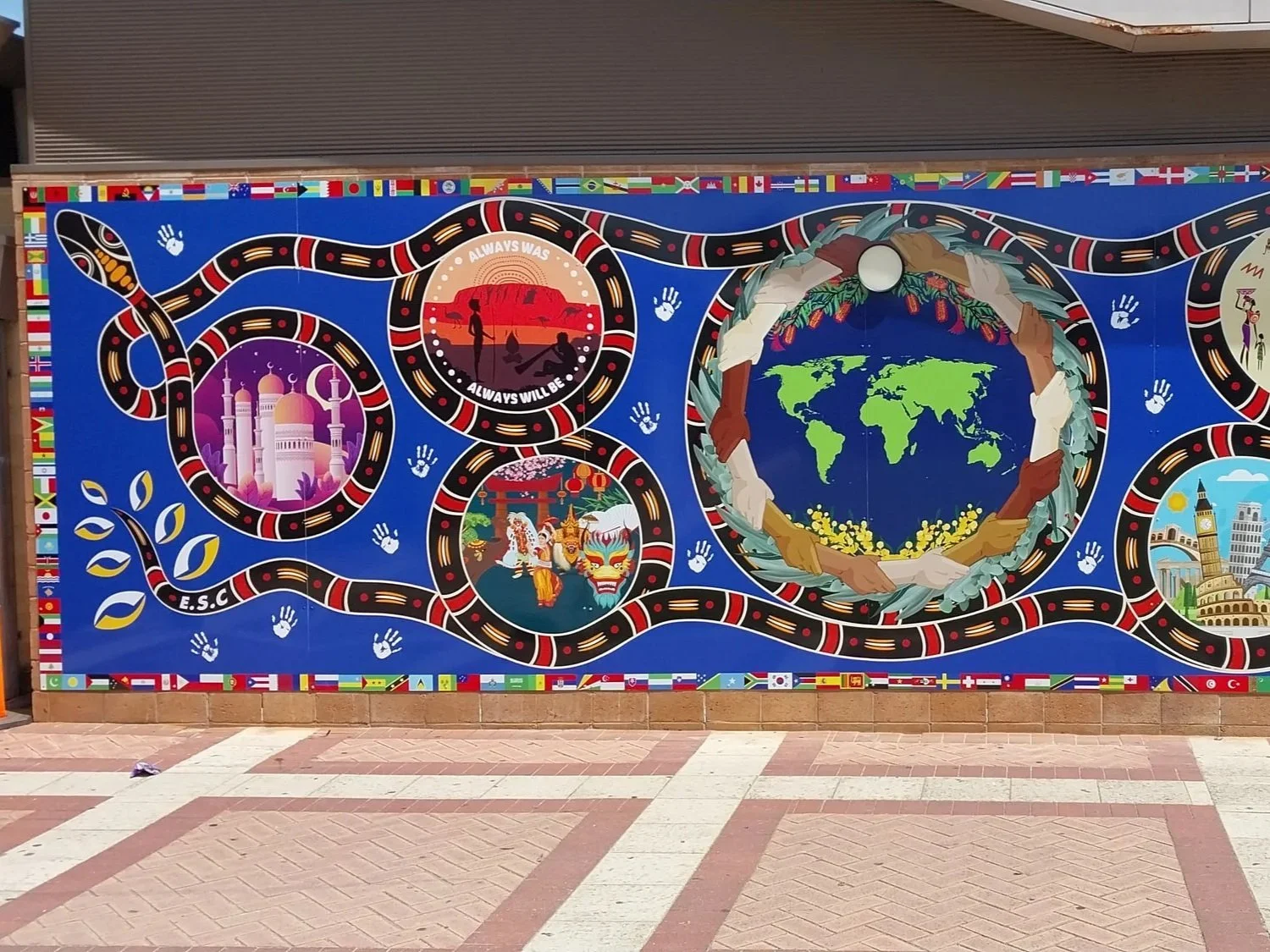 A vibrant mural celebrating cultural diversity at Ellenbrook Secondary College. Ellenbrook school signage. Education Signage Ellenbrook. Perth School Signage. Diversity Signage Perth. Mural Signage Perth. College Signage Perth.