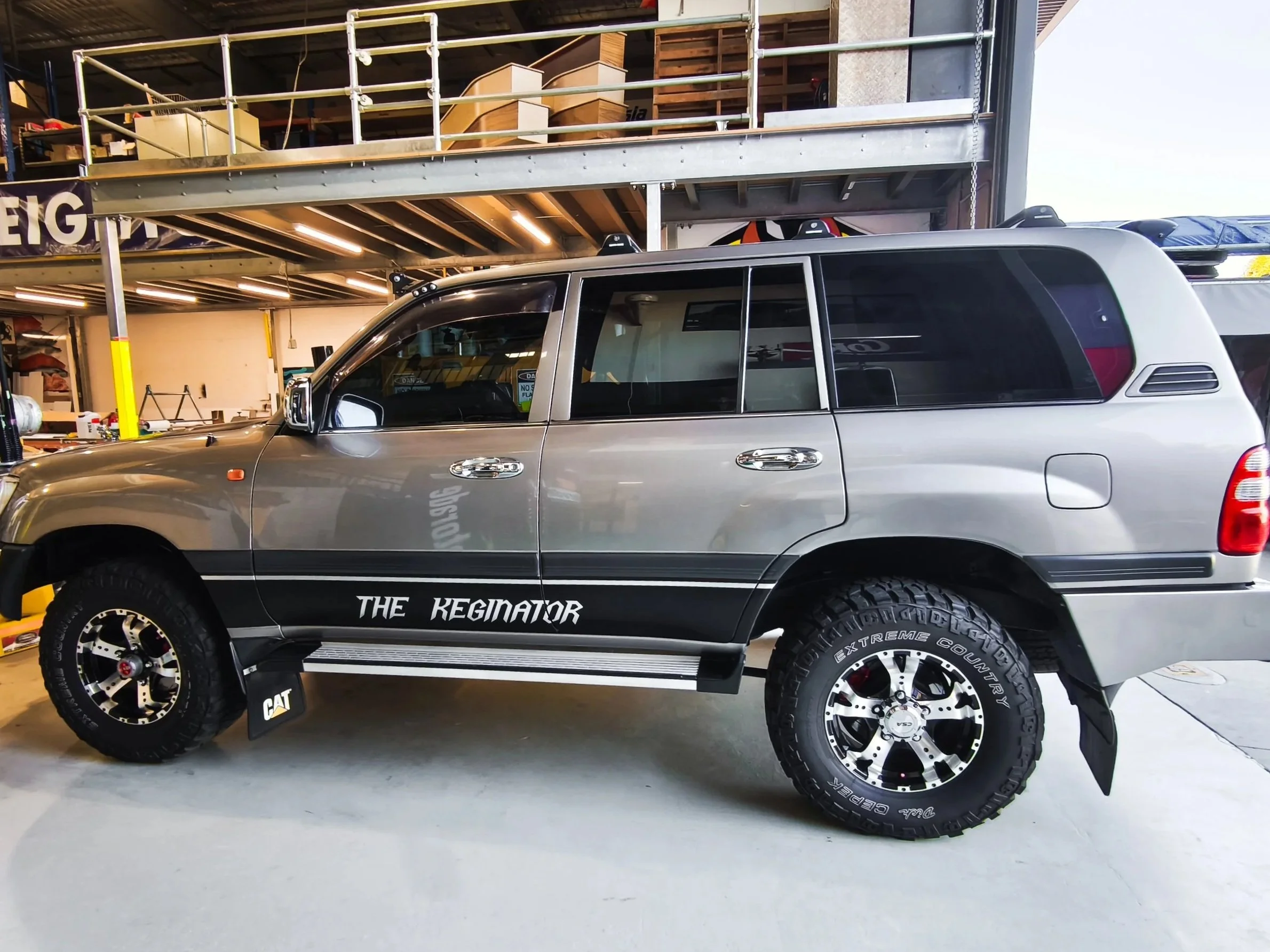 A Silver Toyota Landcruiser 105 Series fitted with Custom Lower Door Band Decals in Perth WA. Custom 4wd Decals Perth, WA. Personalised vehicle decals Perth, WA. Landcruiser Decals Perth, WA. Landcruiser Stickers Bellevue. Custom Decals Midland.