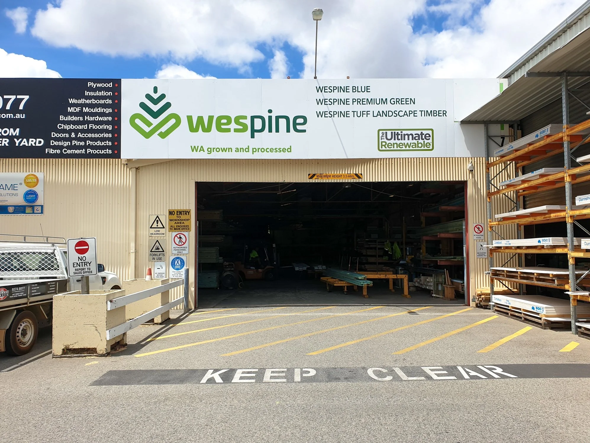 Exterior of a hardware store with signage for Wespine wood. ACM Panel Fascia Signage Commercial Branding