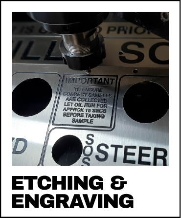 custom etching and engraving services using laser etching and router engraving to create precise tags for machinery and safety compliance. A stainless steel tag being engraved