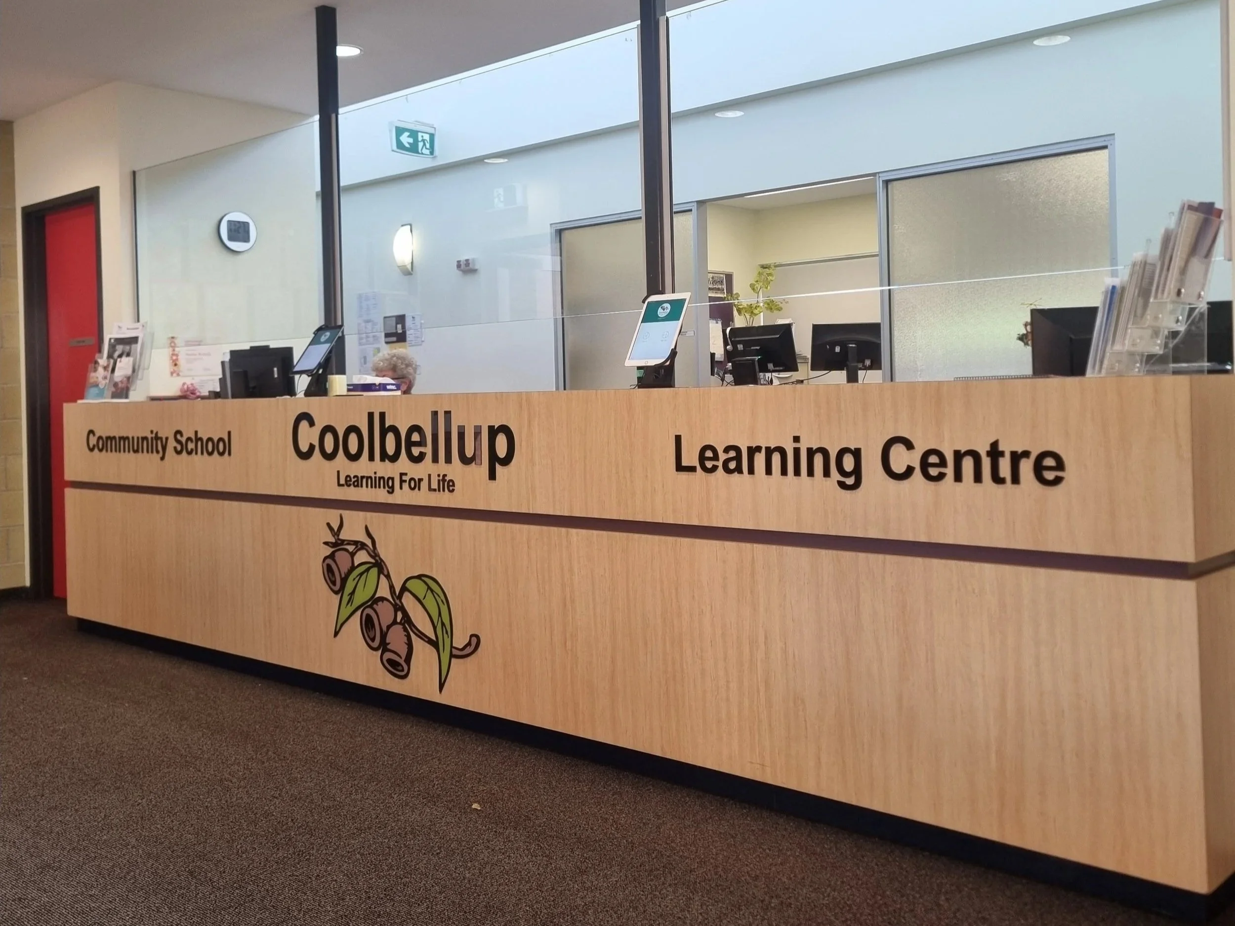 Interior of a learning center at Coolbellup Community School, showing a reception desk with a cartoon illustration of a koala bear at 15 Waverley Rd, Coolbellup WA 6163. Coolbellup Signage. School Signage Coolbellup. Reception Desk Signage Coolbellup