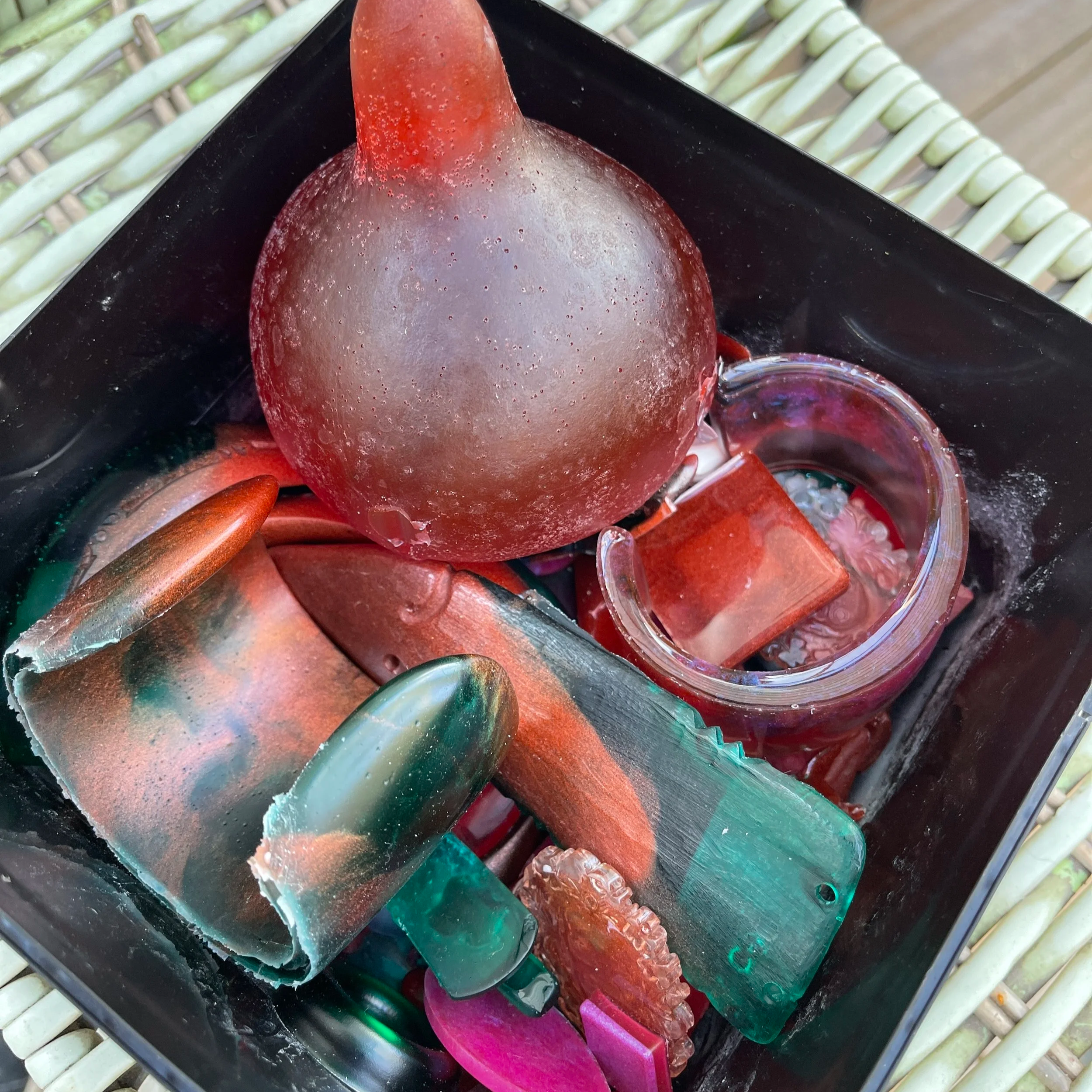 Image: Container of resin taonga I made in 2025. Creating resin taonga often feels therapeutic. As I reflected on Vaioleti's concept of vā, I wondered if this creative space  (and potentially a space of vā) is where my hononga with each piece begins 