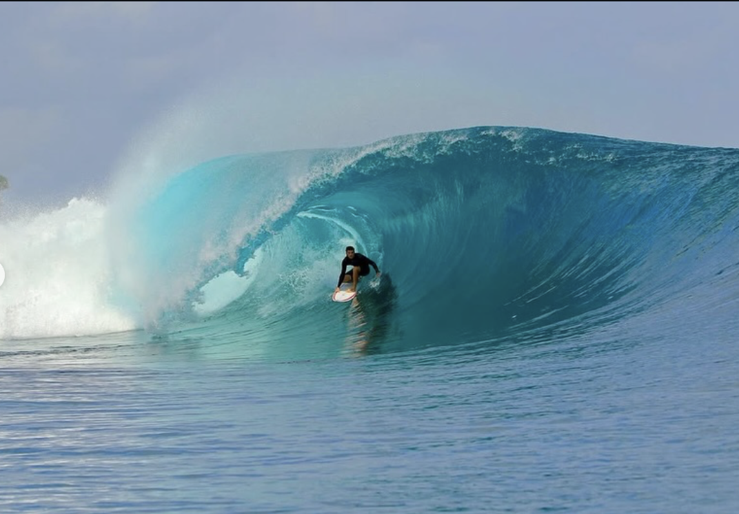Newcastle local surfer getting pitted inside a big barrel somewhere in the jungle on a Shortie Surfboard HP Camel model surfboard.