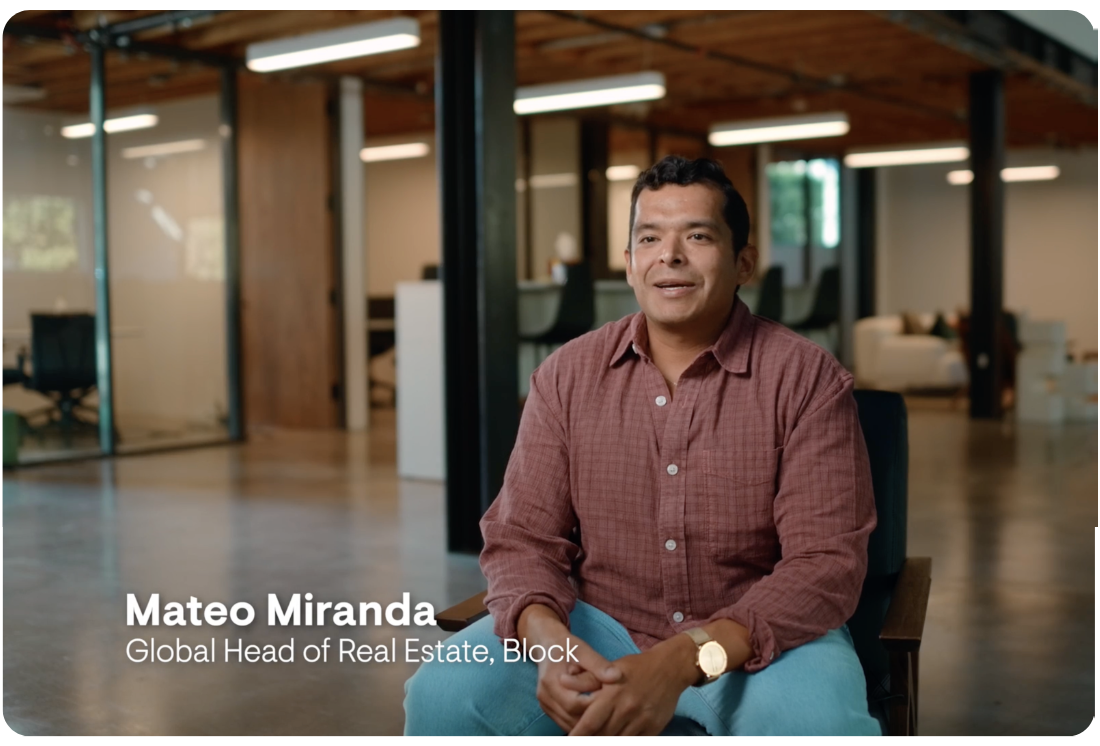 Portrait of Mateo Miranda, Global Head of Real Estate, Block, seated in a modern office with glass walls and wooden accents.