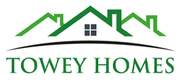 Logo for Towey Homes featuring green house outlines and the company name