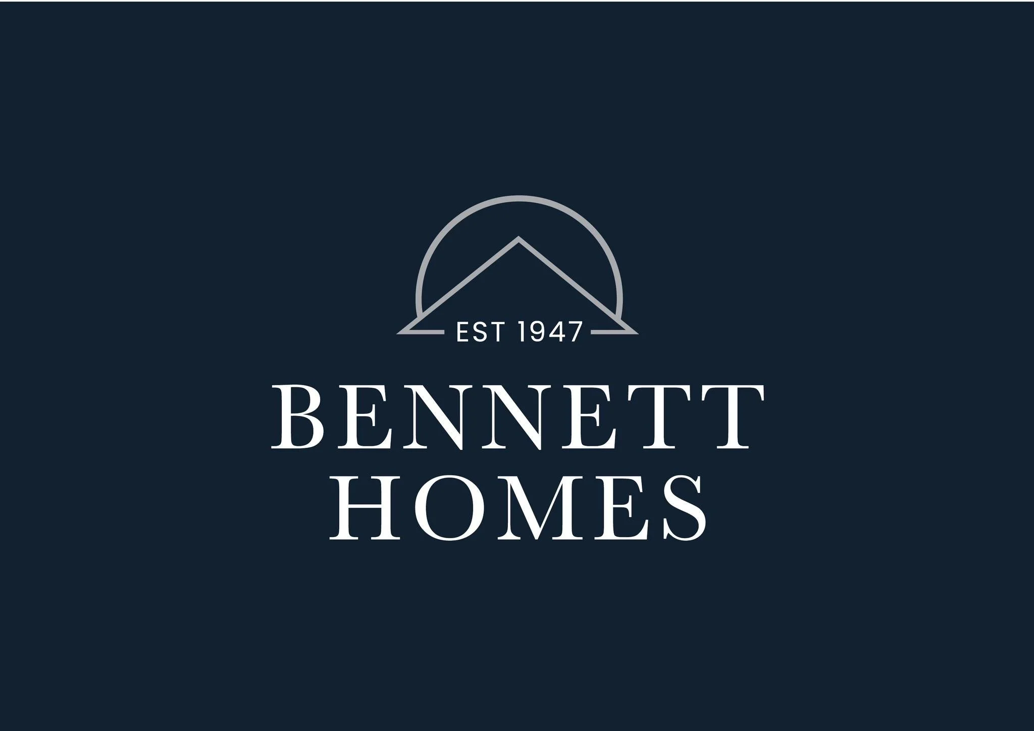 Logo with a mountain outline, the text 'EST 1947', and the words 'BENNETT HOMES' on a dark background.