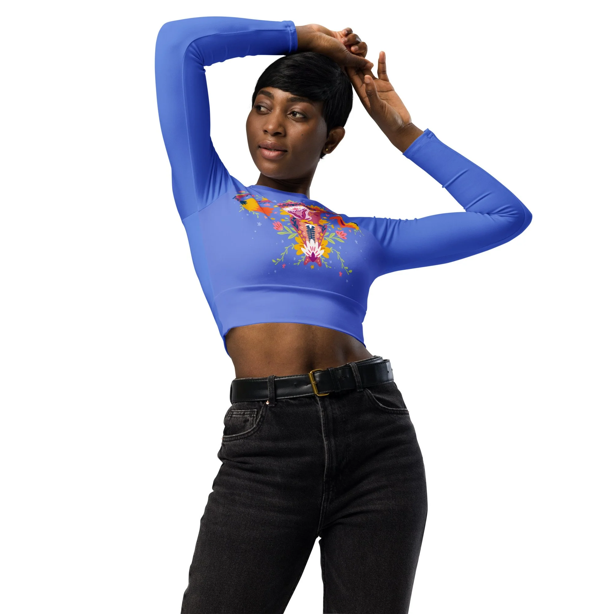 Close-up of a woman with short black hair wearing a blue long-sleeve top with colorful menopause uterus illustration, posing with one arm raised and her hand on her head, against a plain white background. Up Yours Menopause!' merchandise.