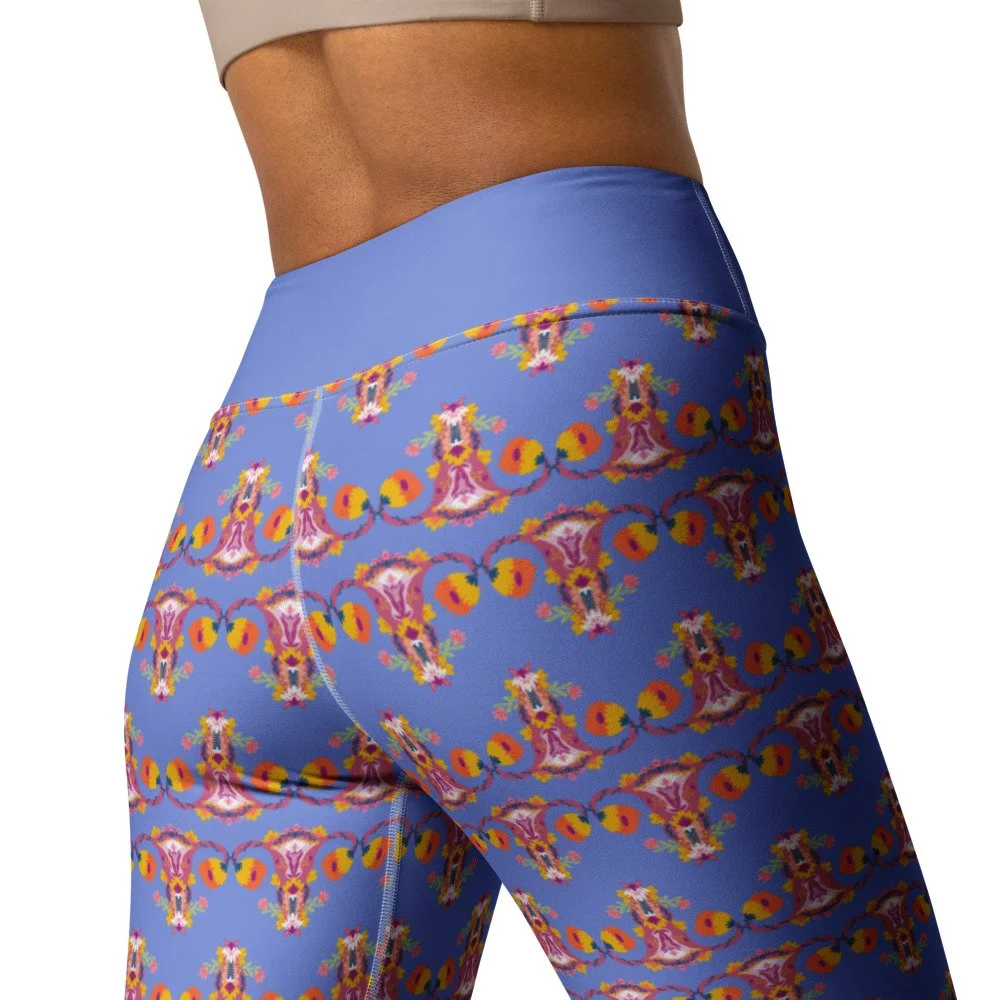 Close-up of a person's lower back and hips wearing blue patterned leggings with a high waistband. Up Yours Menopause!' merchandise.