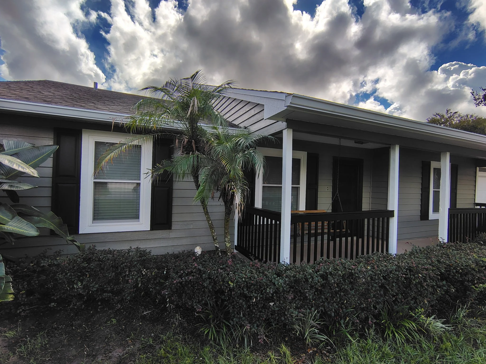 Completed exterior house painting transformation in Apopka FL by Coats of Quality Painting.