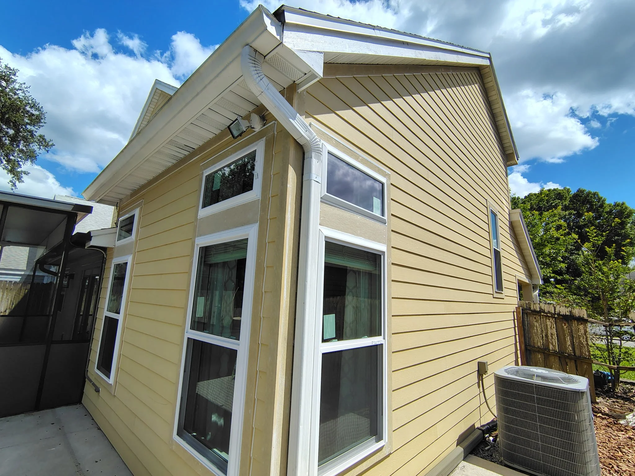 Hardie board siding and windows before painting in Longwood FL