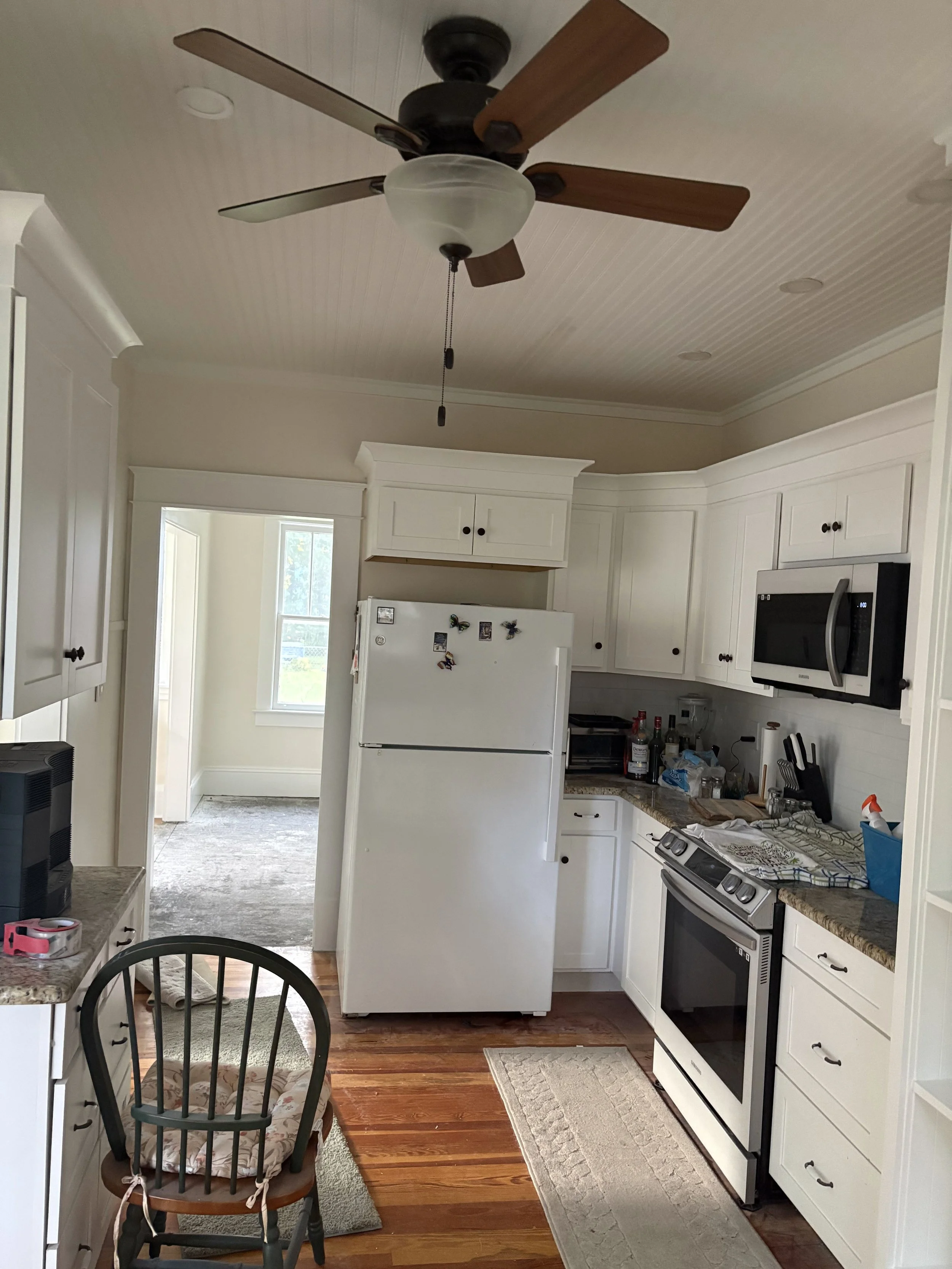 Newly painted dining space in Deland, FL — a fresh, modern white finish brings warmth and brightness.