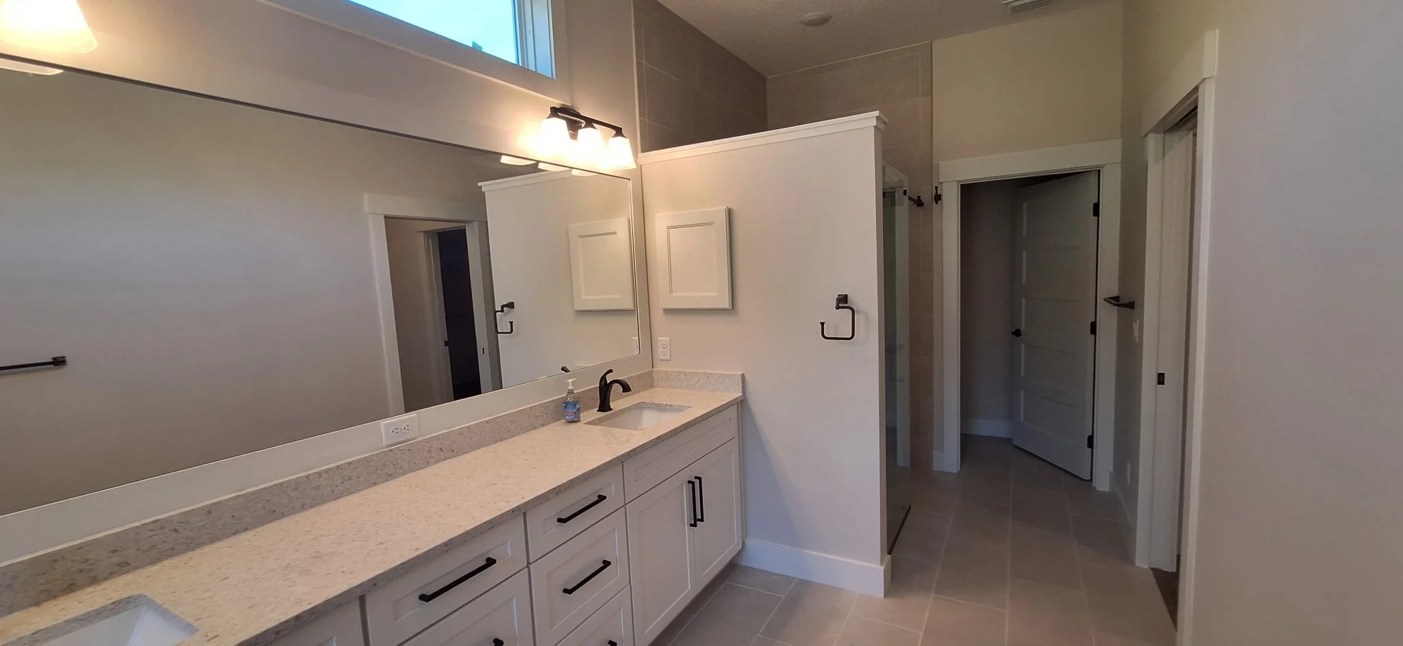 Professional bathroom painting with soft neutrals for a new Sanford, FL home.