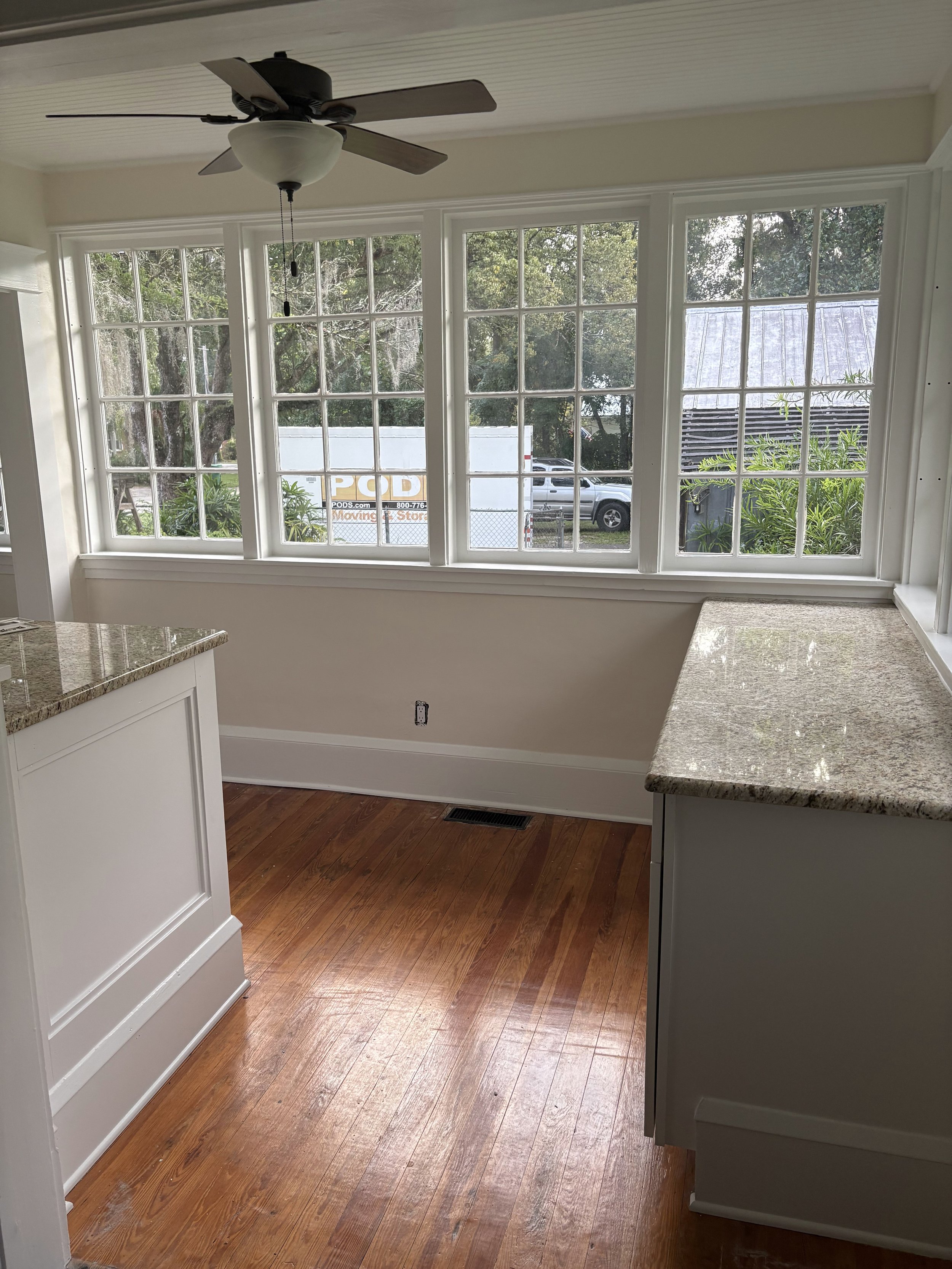 Corner view of a Deland, Florida home showing smooth, freshly painted walls and clean white trim.