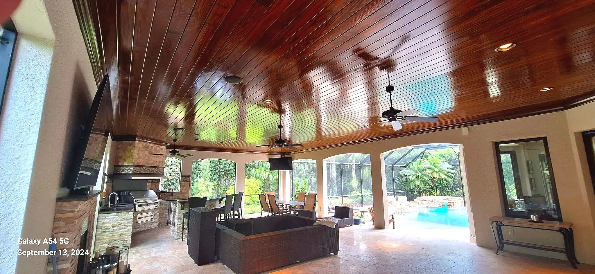 Outdoor living space with stained wood ceiling refinished by Coats of Quality Painting — Volusia County painters serving Daytona Beach, Port Orange, Ormond Beach, New Smyrna Beach, and Deltona