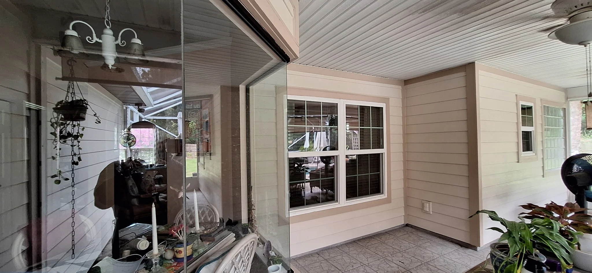covered patio exterior painting Melbourne Florida home with neutral siding