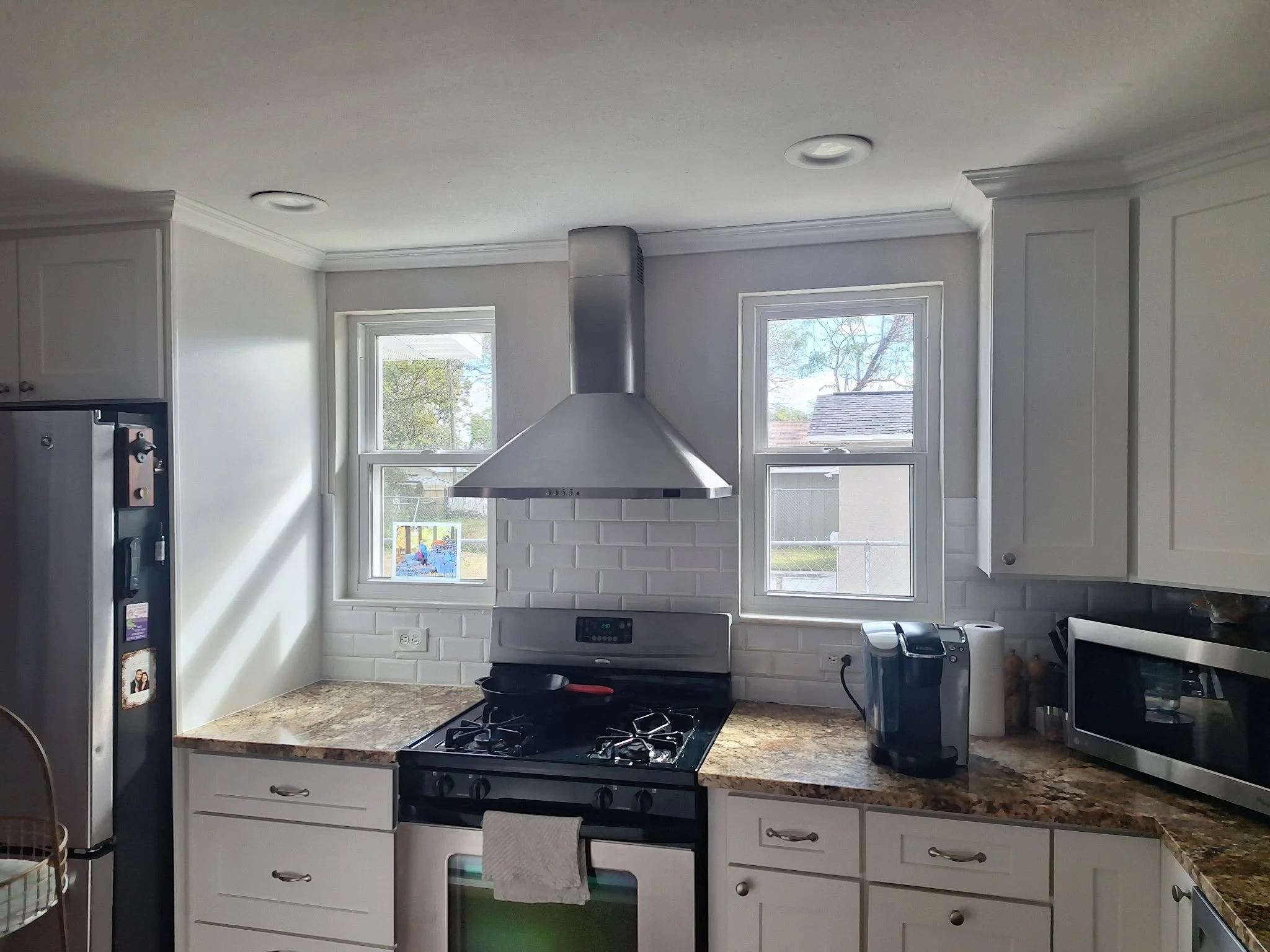 Bright, clean kitchen painting designed to reflect natural Orlando light.