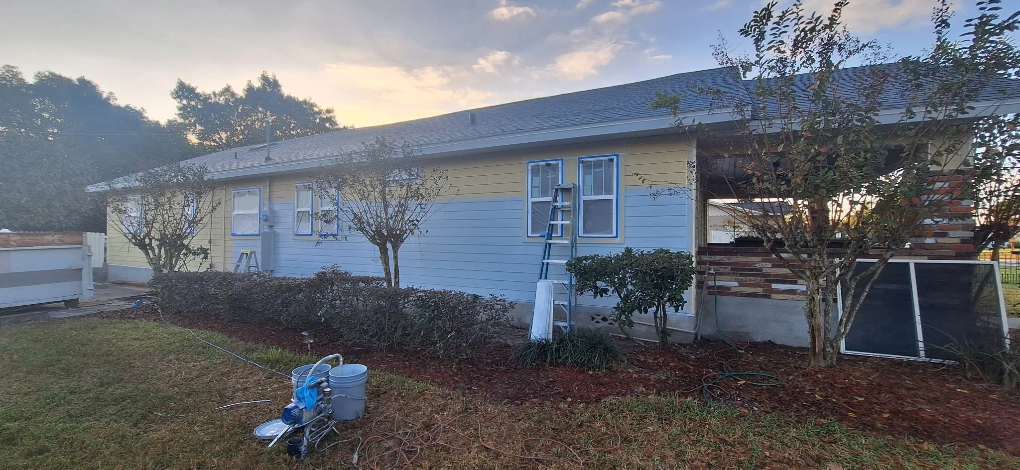 Exterior house painting project in Orlando FL showing home before professional exterior painting by Coats of Quality Painting