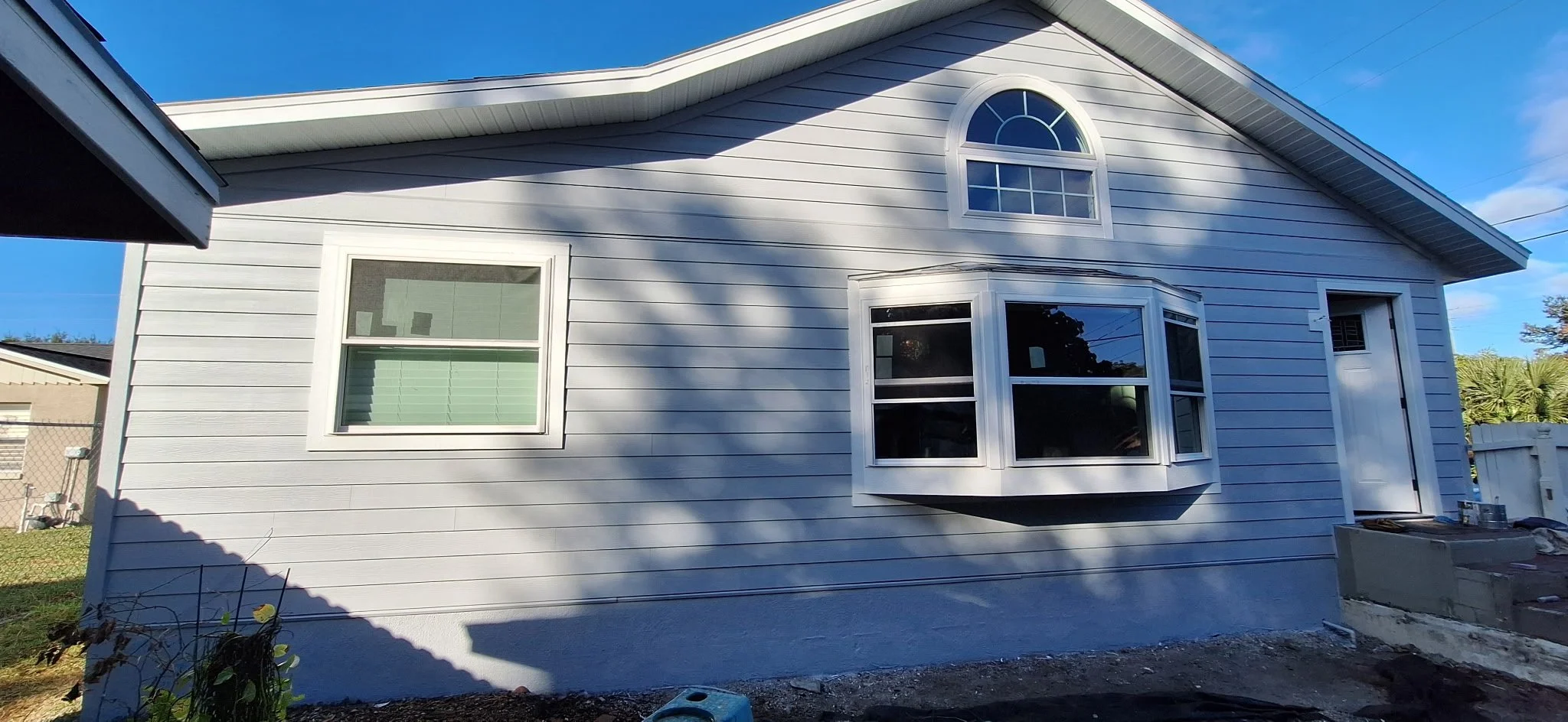 Front porch and entryway exterior painting in Orlando FL with detailed trim work