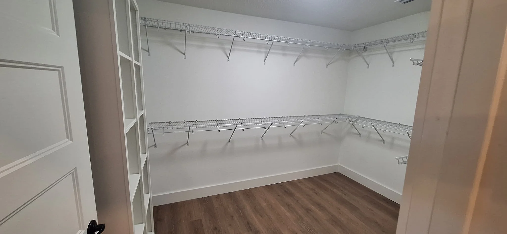 Bright and clean interior paint finish inside a new Sanford walk-in closet.