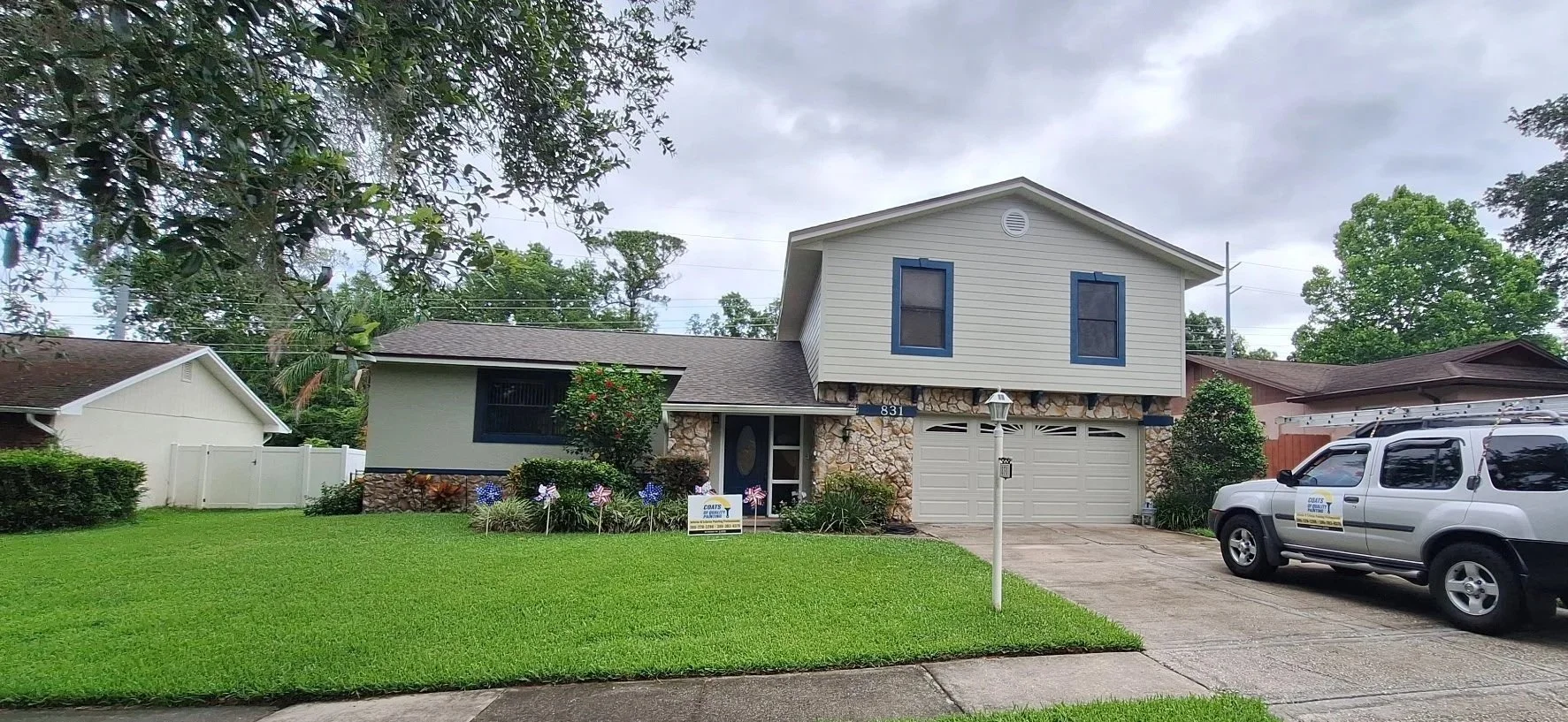 Modern Orlando house exterior with navy blue window trim and neutral siding.