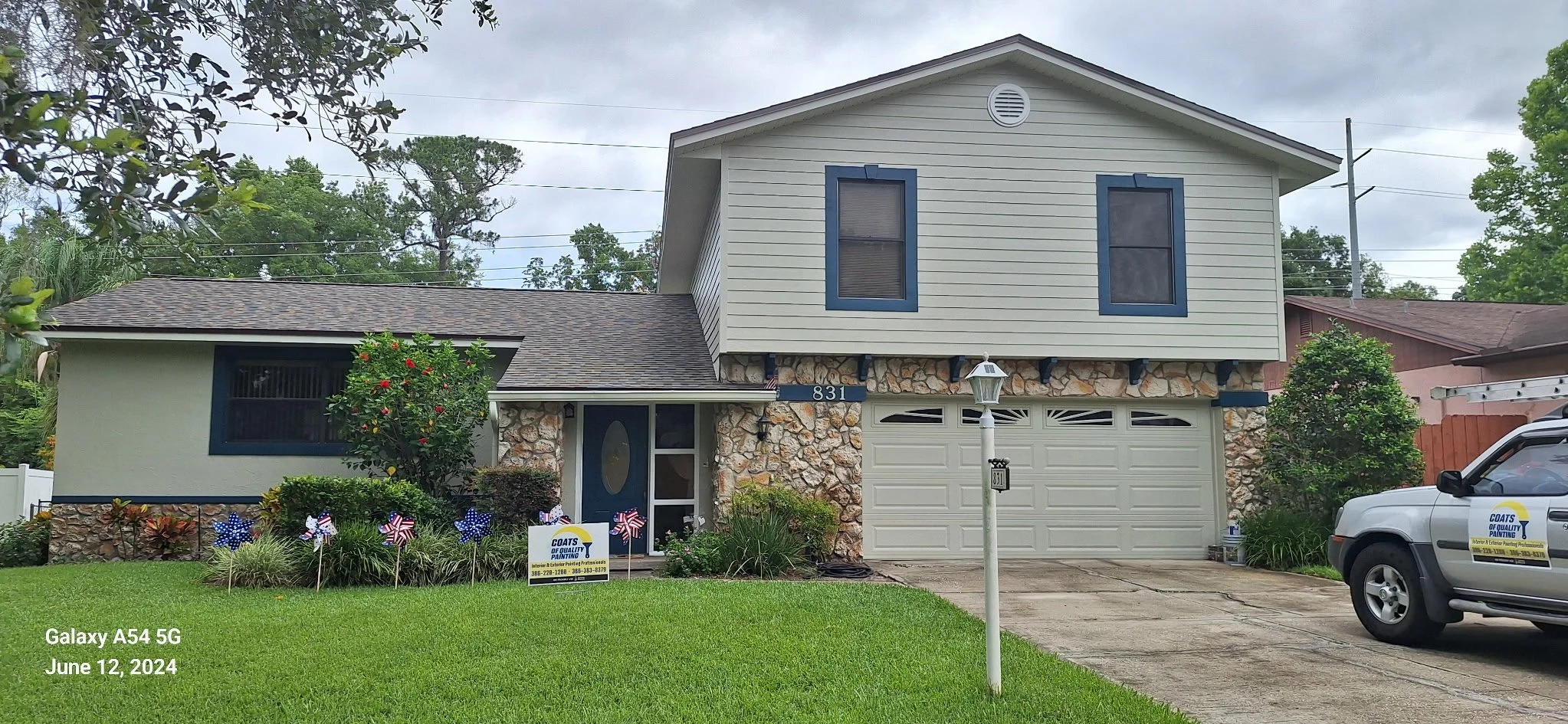 Modern Orlando house exterior with navy blue window trim and neutral siding.