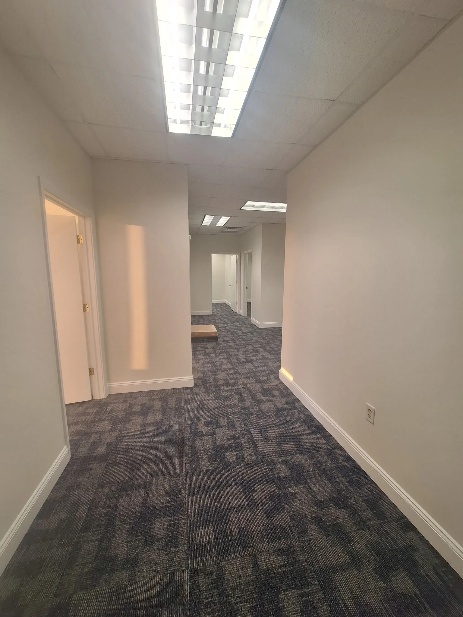 Interior hallway painting at attorney’s office in DeLand FL with neutral walls and commercial finishes