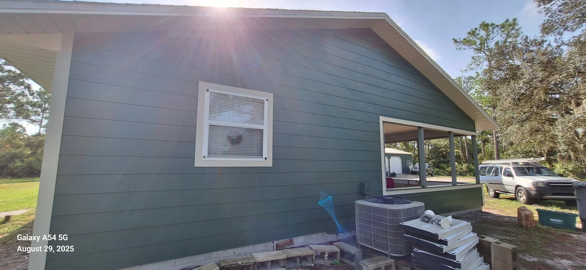 This finished detail shot highlights clean lines, smooth siding, and professional trim work on a New Smyrna Beach home. The exterior paint system was selected to resist fading, moisture, and mildew.