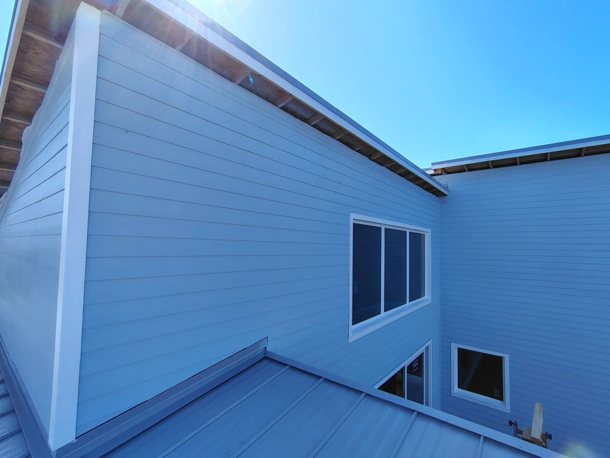 Port Orange Blue Lap Siding and Metal Roof Exterior Paint