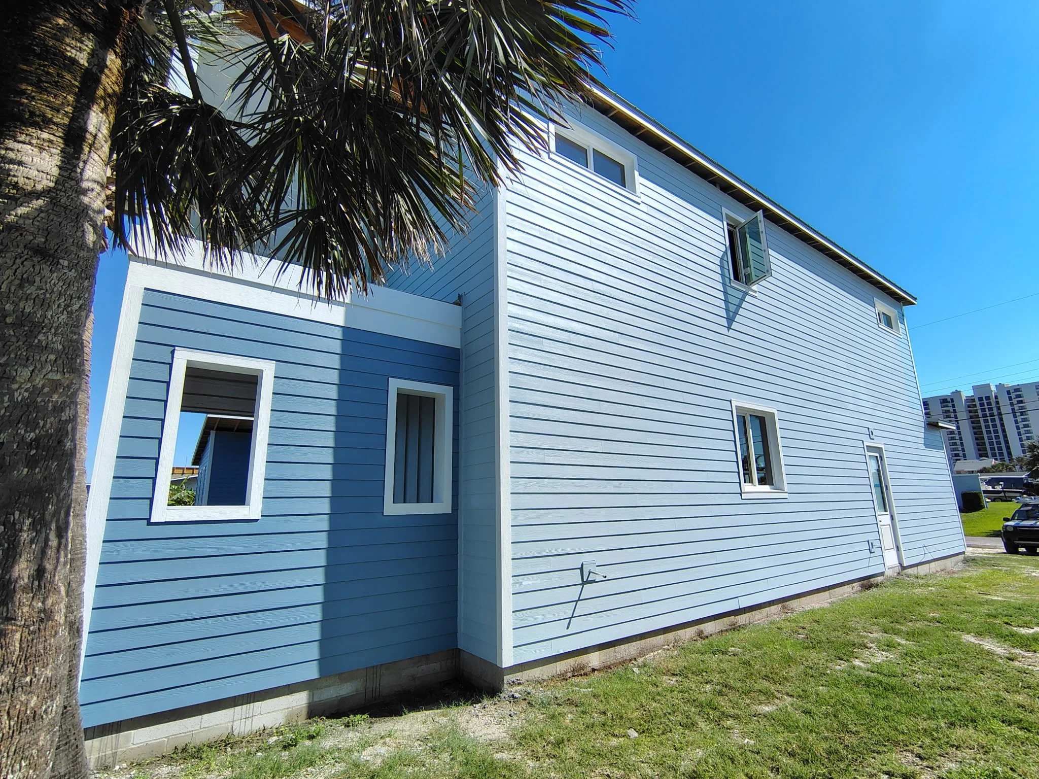 Port Orange New Build Exterior Blue Siding Side View