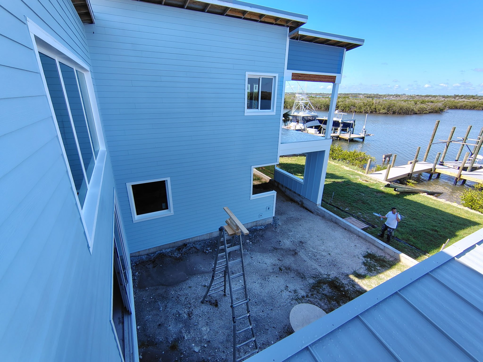 Port Orange Coastal New Build Exterior Paint Waterfront Courtyard