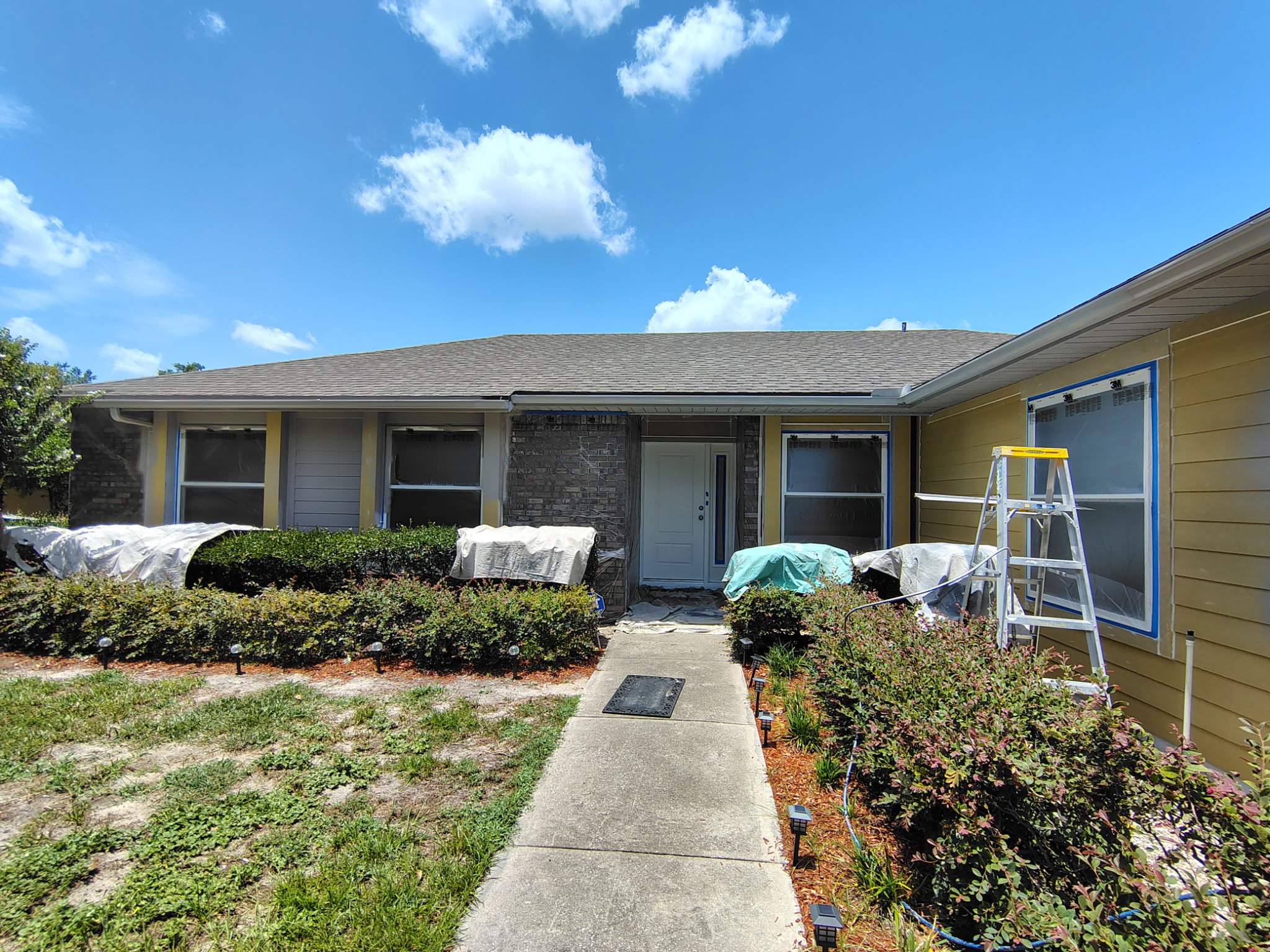 From Warm Yellow to Modern Gray: An Ocoee Exterior Painting Before and After