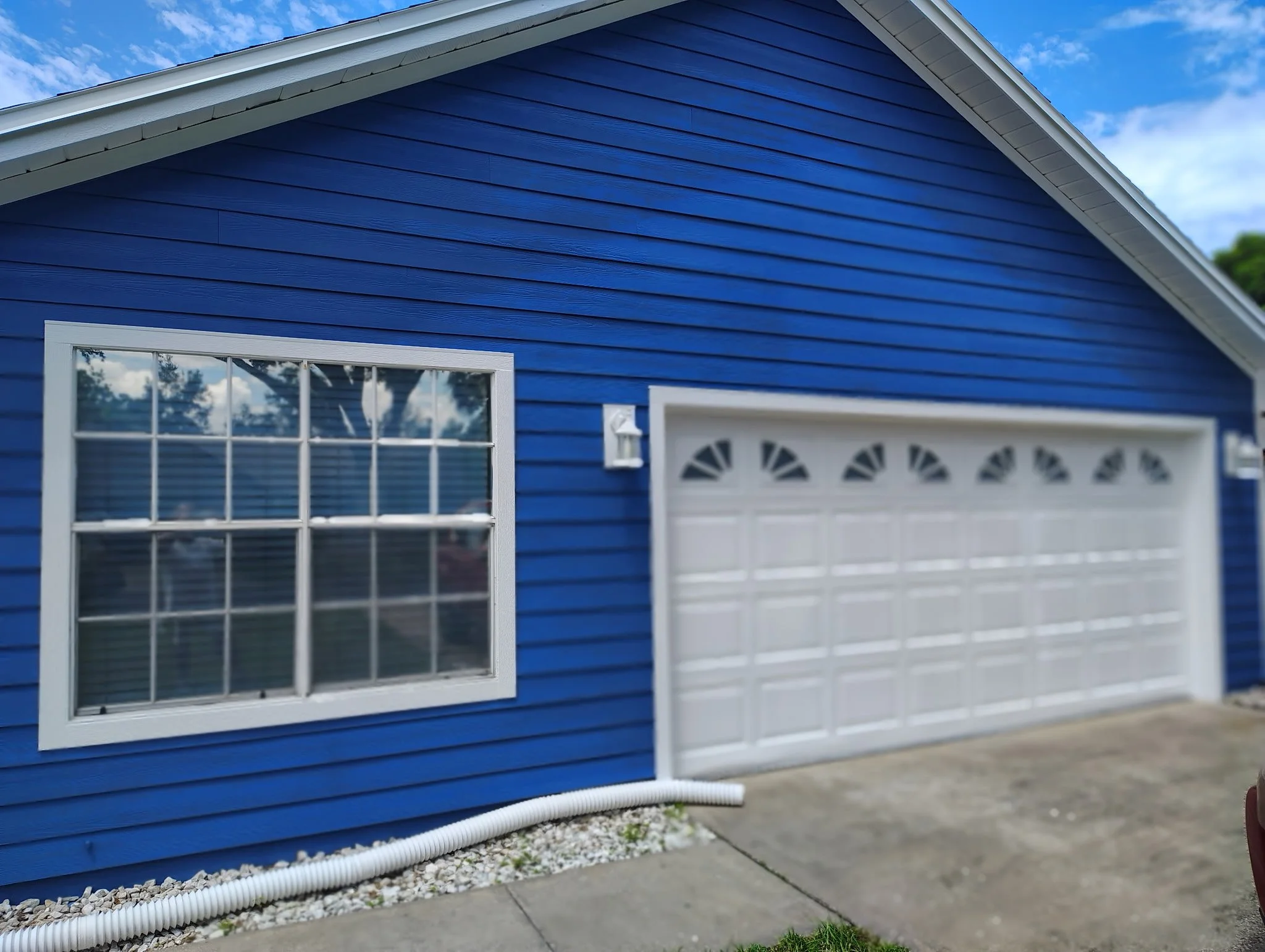 AFTER — BLUE GARAGE EXTERIOR