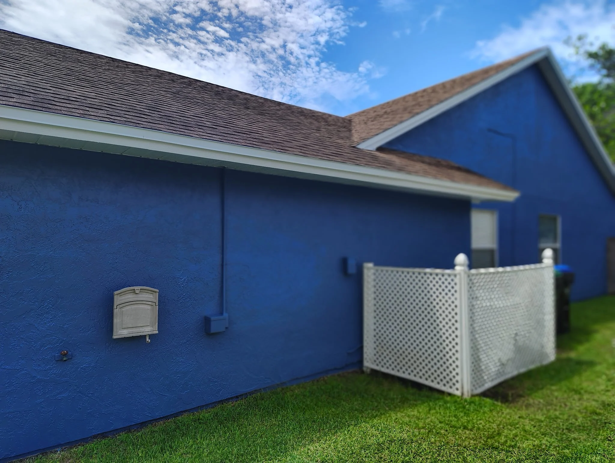 AFTER — BLUE STUCCO SIDE