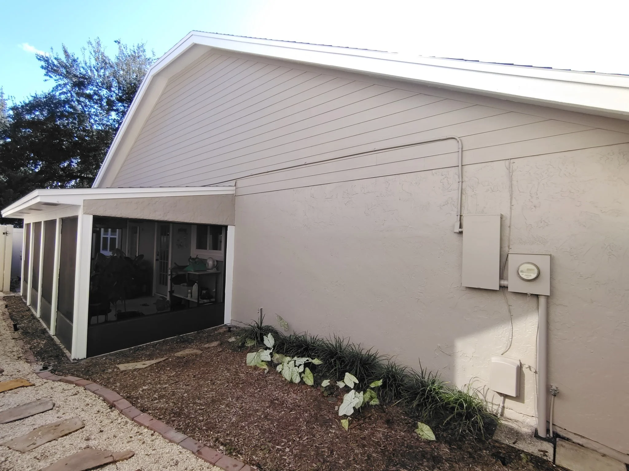 Neutral gable siding and side stucco wall