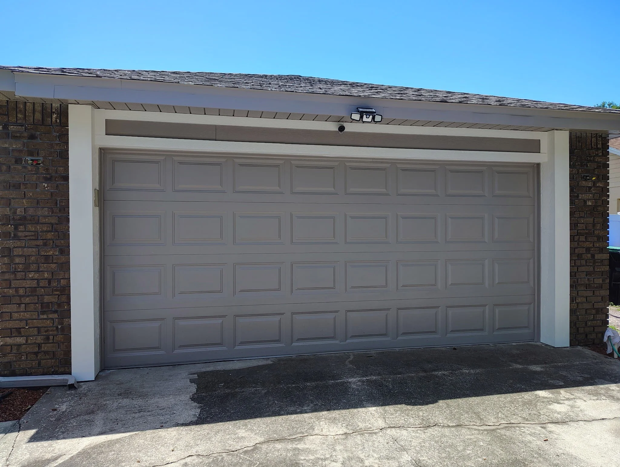 Wide finished view of a modern gray home after exterior painting in Ocoee FL