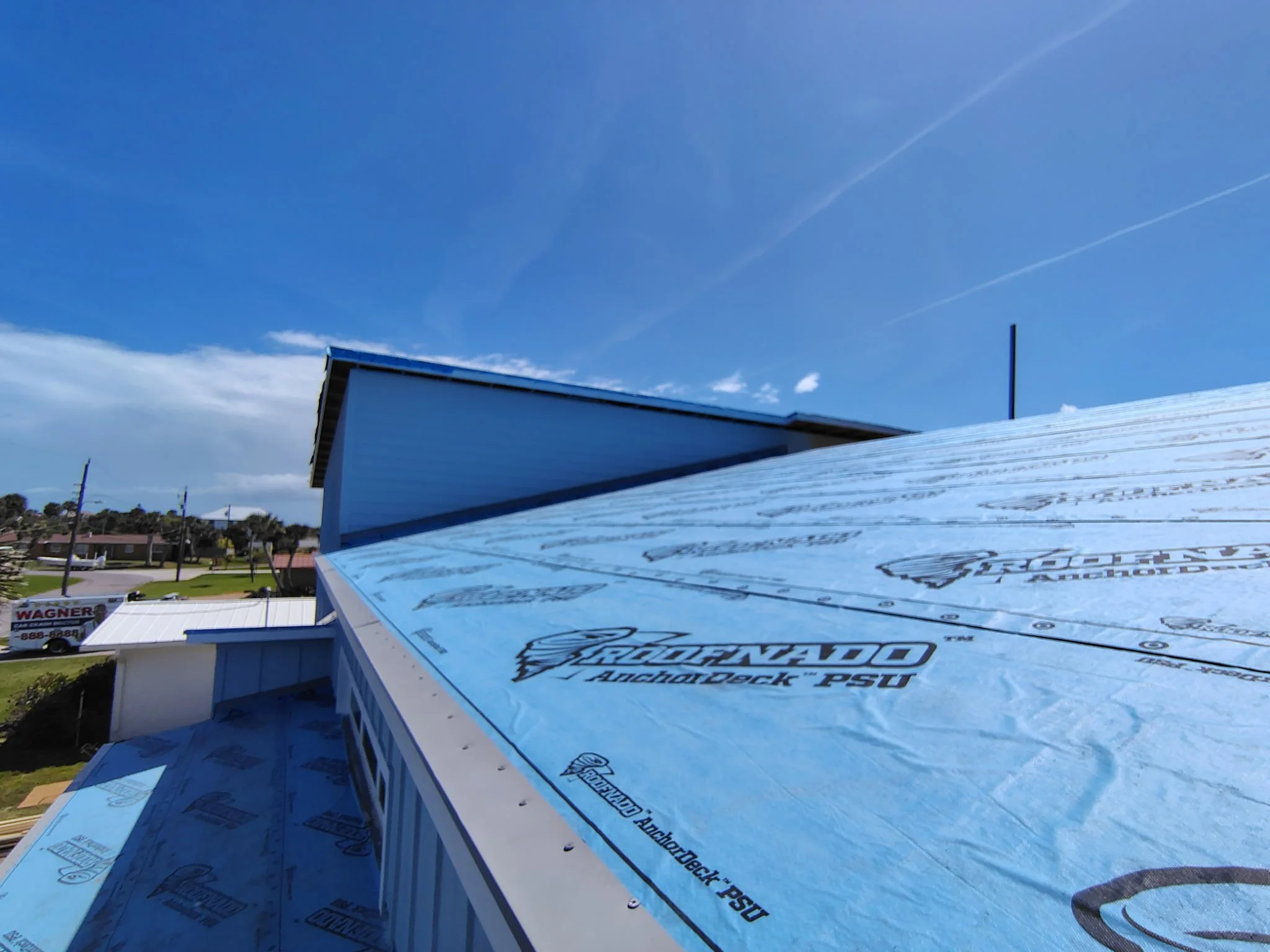 Roof deck preparation for exterior painting project in South Daytona with protective underlayment installed