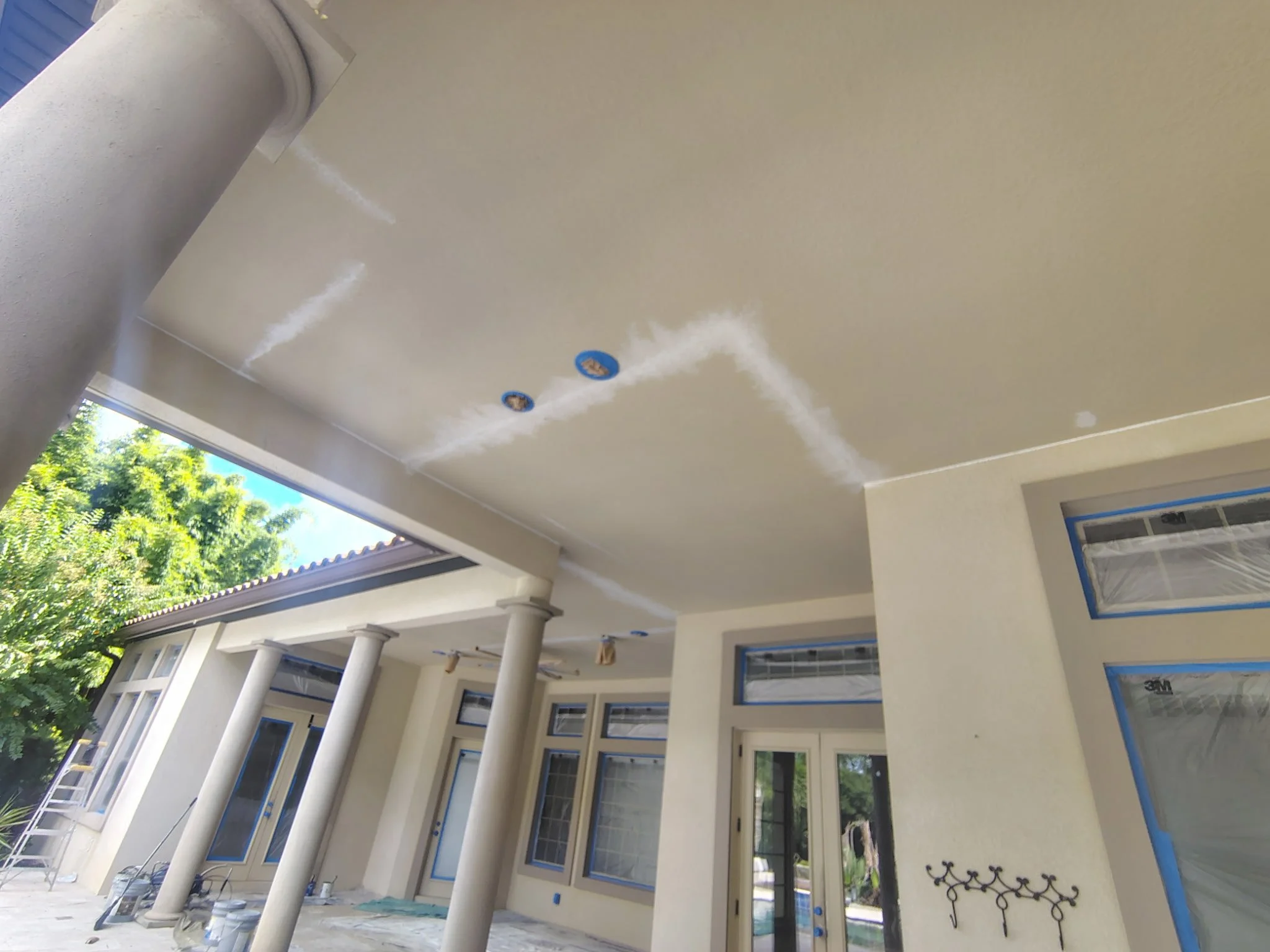 Patio ceiling repair and exterior painting preparation on a Sanford FL home