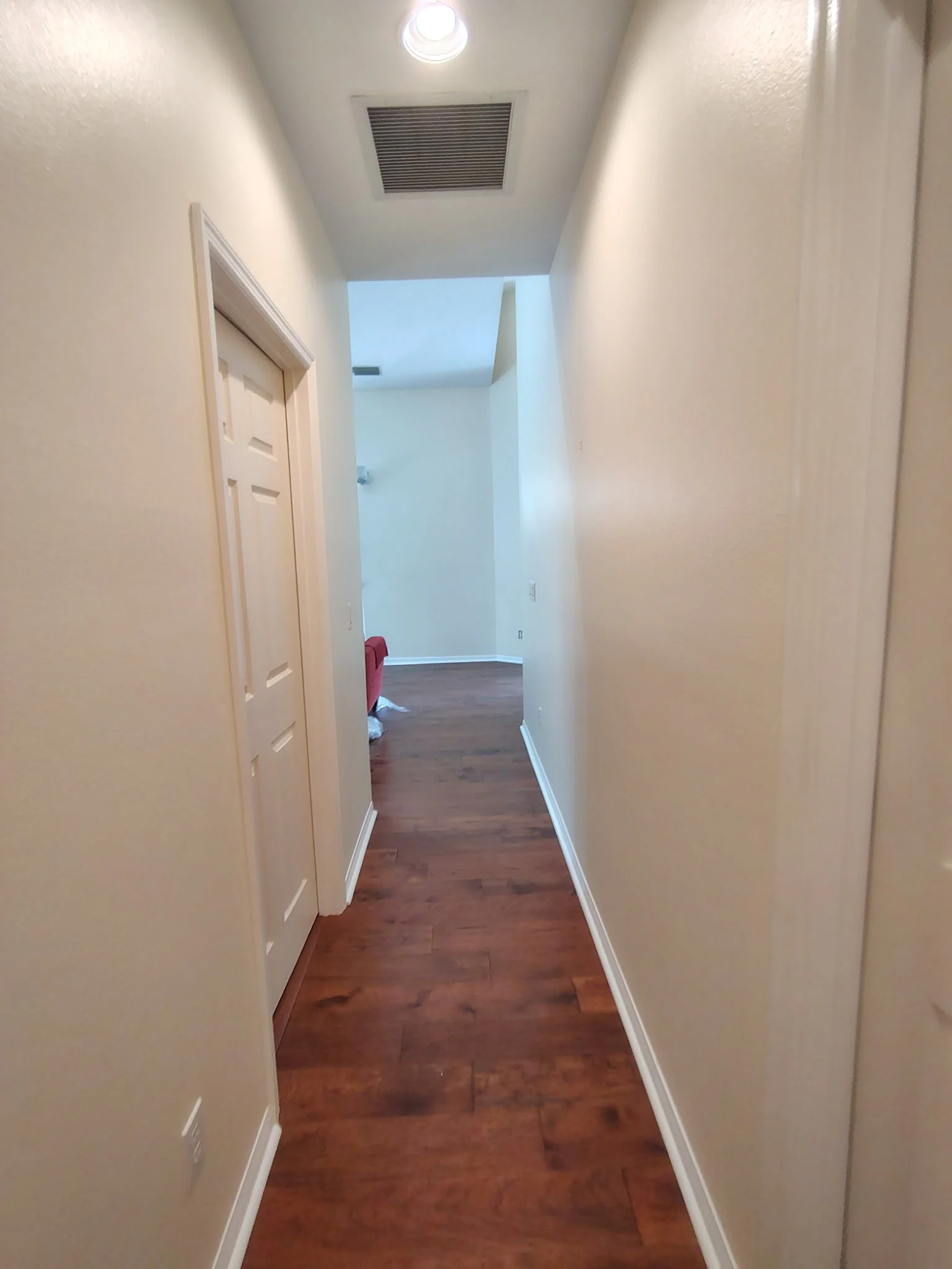 Orlando hallway wall and trim painting with fresh neutral paint and white door trim.