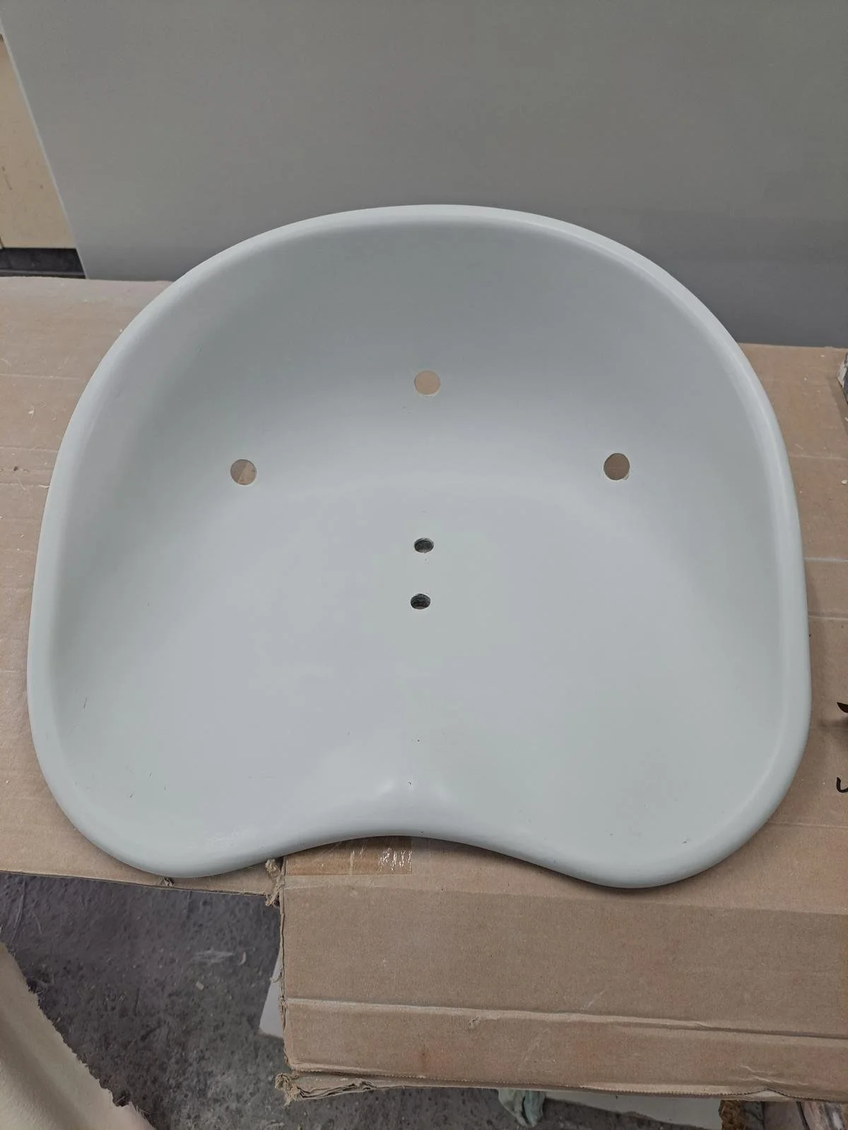 White seat for a vehicle made from fiberglass composites