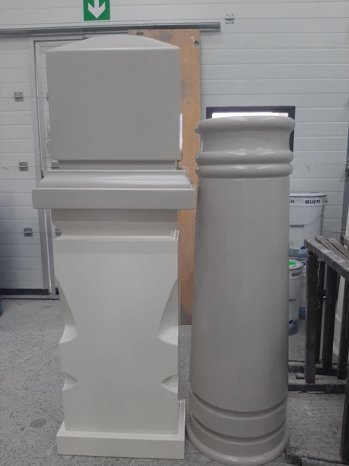 White decorative pillars of different sizes made from fiberglass composites